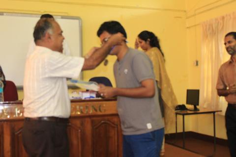 Mr. Ankur Jyoti receiving the Best Outgoing Student Award from Prof. S Chandraka